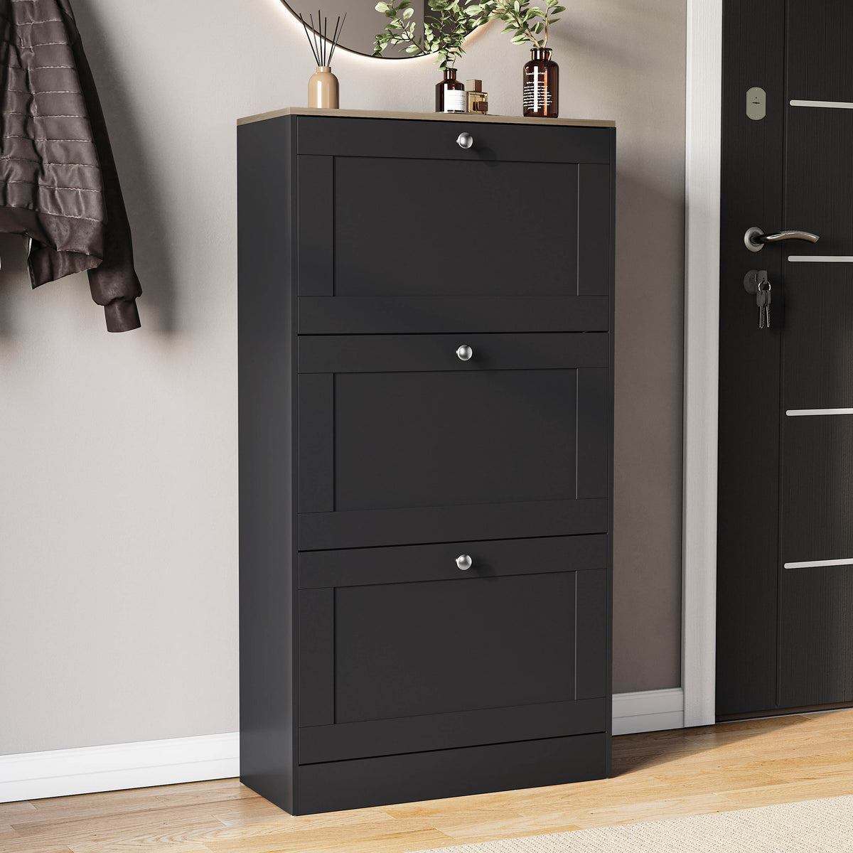 Three-drawer shoe cabinet in black & oak, with three pull-out drawers.
