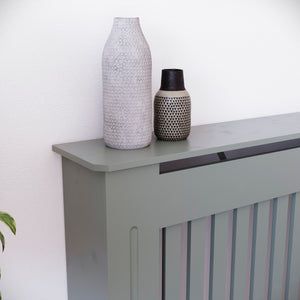 Large Chelsea radiator cover in olive grey with a decorative slatted front.
