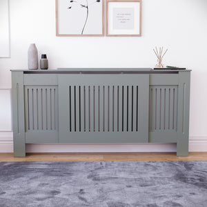 Adjustable Chelsea radiator cover in olive grey with a decorative slatted front.
