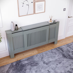Adjustable Chelsea radiator cover in olive grey with a decorative slatted front.
