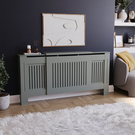 Adjustable Chelsea radiator cover in olive grey with a decorative slatted front.
