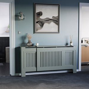 Adjustable Chelsea radiator cover in olive grey with a decorative slatted front.
